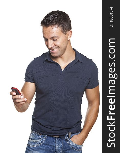 Young and smiling man looking at his cellphone