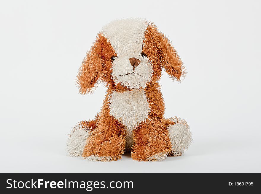 Soft toy brown and cream colour dog