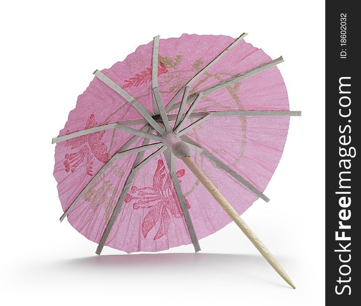 Rose cocktail umbrella on white background