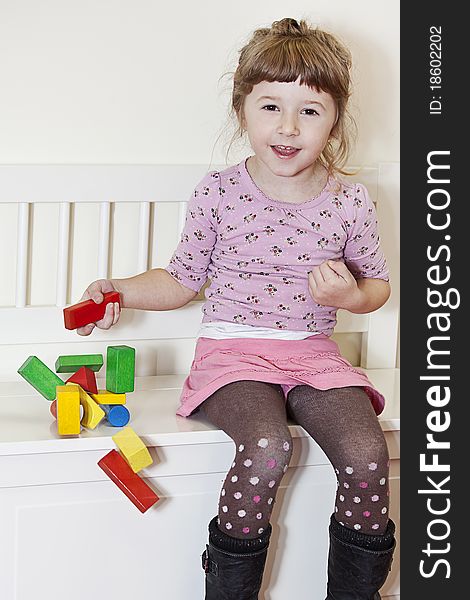 Girl and wooden blocks