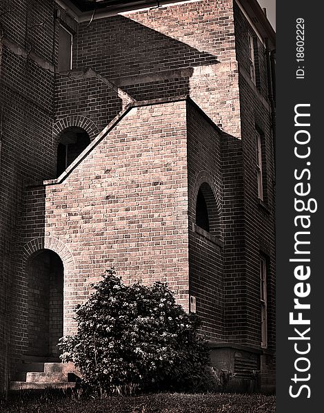 Old vintage brick building in sepia tone