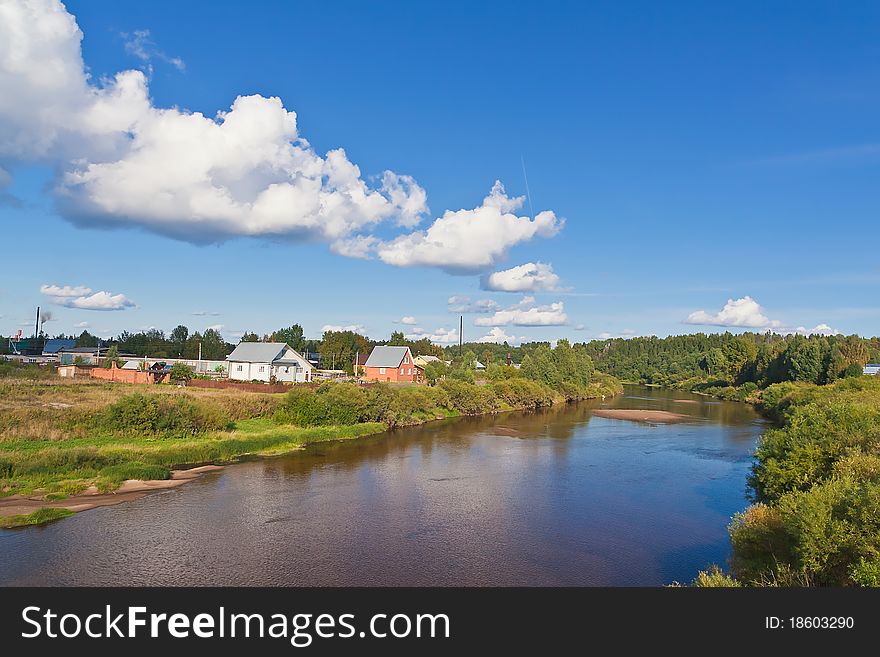 Summer landscape with river and blue sky