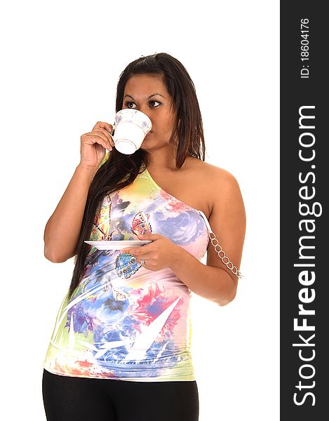 A pretty Asian woman drinking her coffee and holding the saucer, in a colorful blouse and long black hair, for white background. A pretty Asian woman drinking her coffee and holding the saucer, in a colorful blouse and long black hair, for white background.