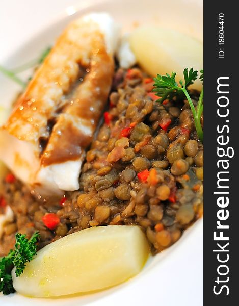 Baked salmon cuisine with bean and potato dressing. Baked salmon cuisine with bean and potato dressing.