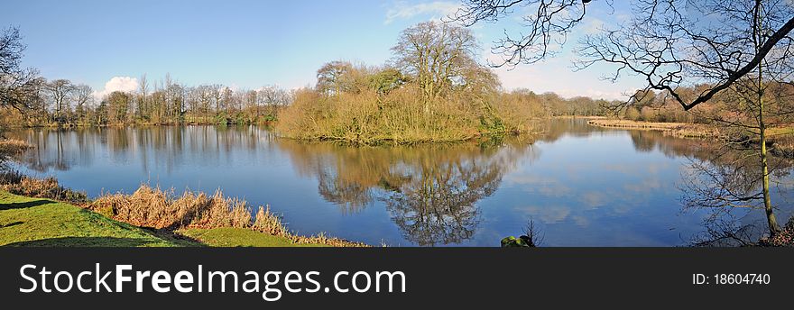 The lake and late winter landscape of 
rode hall gardens in cheshire in england. The lake and late winter landscape of 
rode hall gardens in cheshire in england