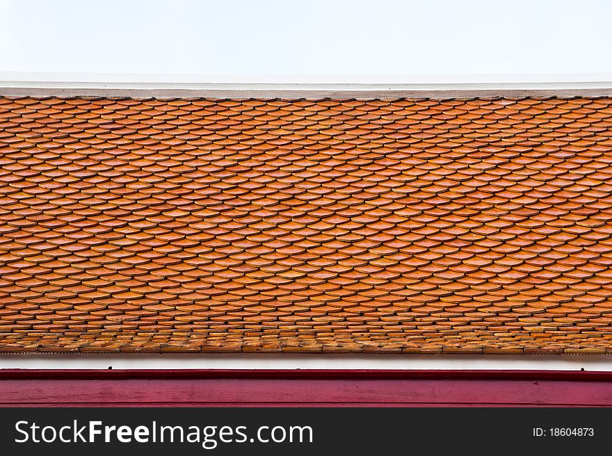 Thai temple roof with brown tiles