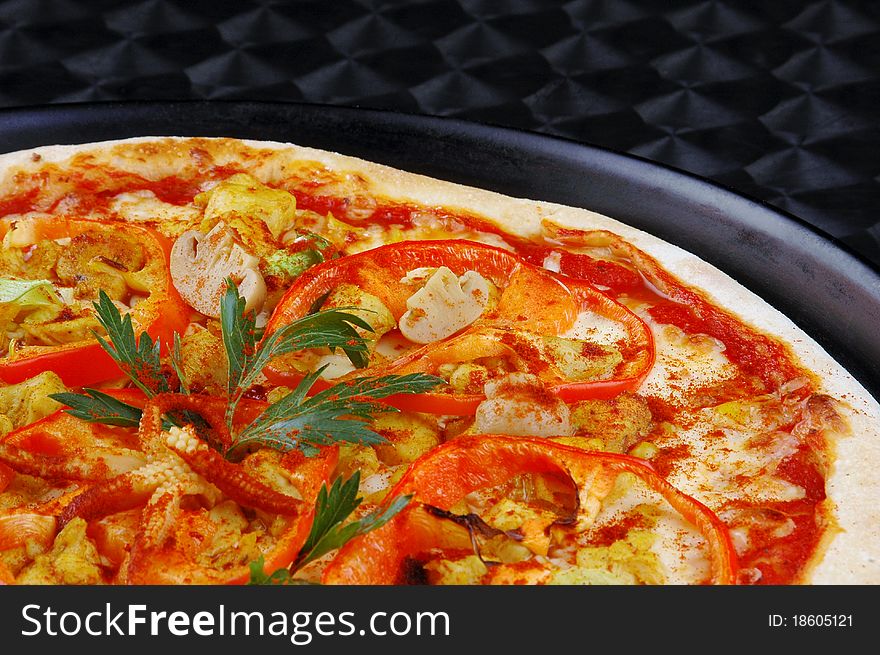 Appetizing italian pizza with tomatoes, paprika, onion on steel background. Appetizing italian pizza with tomatoes, paprika, onion on steel background