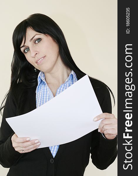 Business woman with blue eyes having a paper in her hands smiling looking at the camera. Business woman with blue eyes having a paper in her hands smiling looking at the camera