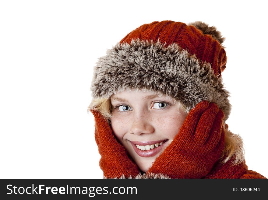 Young blond girl with winter cap and gloves. Isolated on white background.