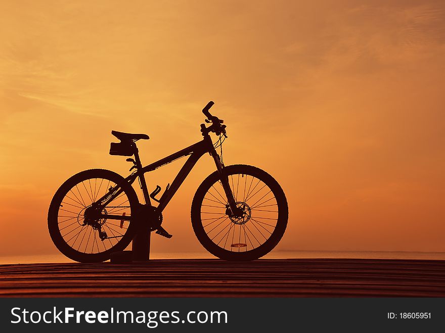 Single bike silhouette during sunset.