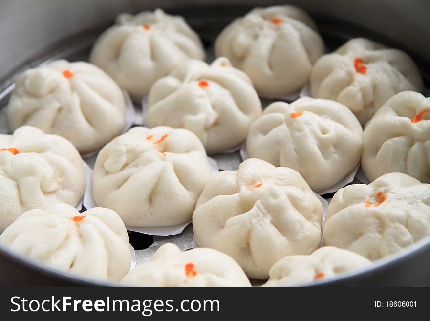 Cream buns are steamed on the stove. Cream buns are steamed on the stove.