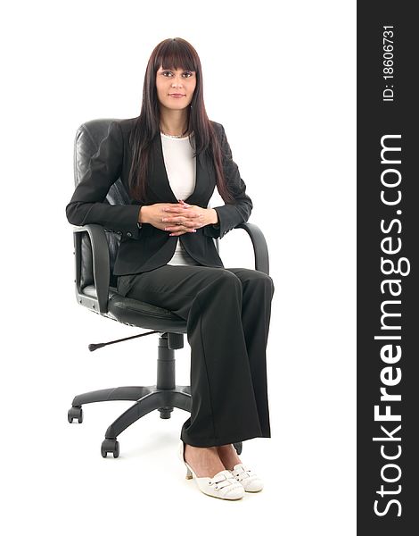 Businesswoman sits in headchair, on white background.