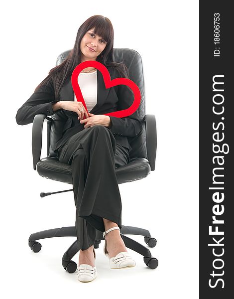 Woman sits in headchair with red heart, on white background. Woman sits in headchair with red heart, on white background.