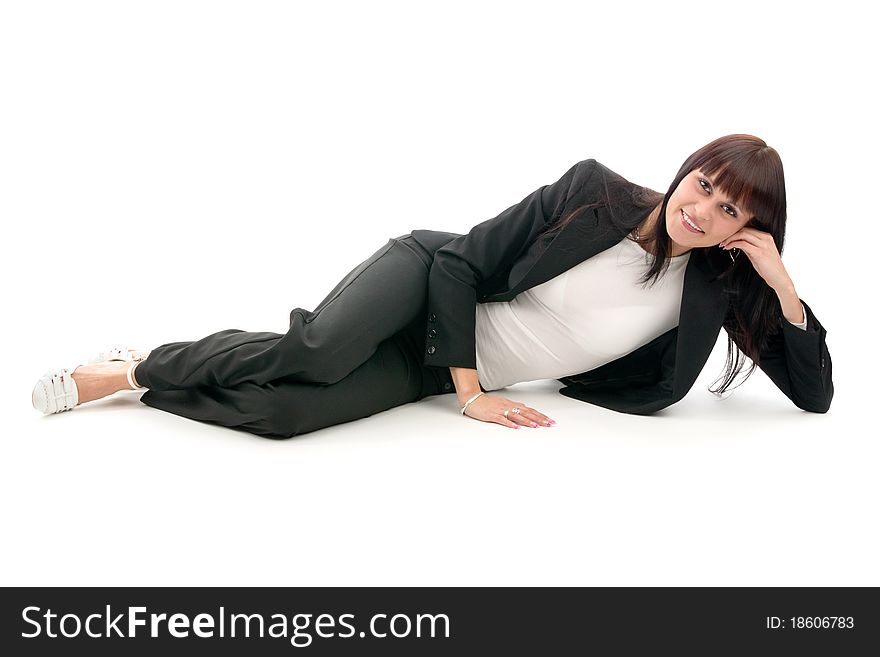 Woman in suit lies, on white background.