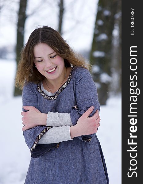 Frozen girl in medieval dress in winter. Frozen girl in medieval dress in winter