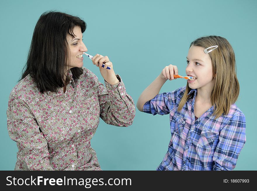 White child studying brushing tooth and mother teaching. White child studying brushing tooth and mother teaching