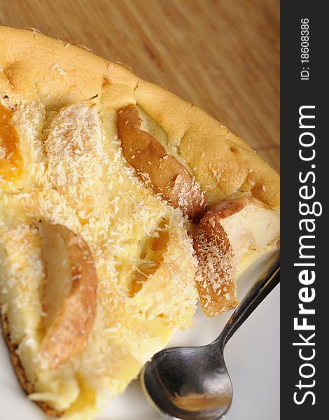 Studio close-up with tasty apple cake and spoon on white plate. Studio close-up with tasty apple cake and spoon on white plate