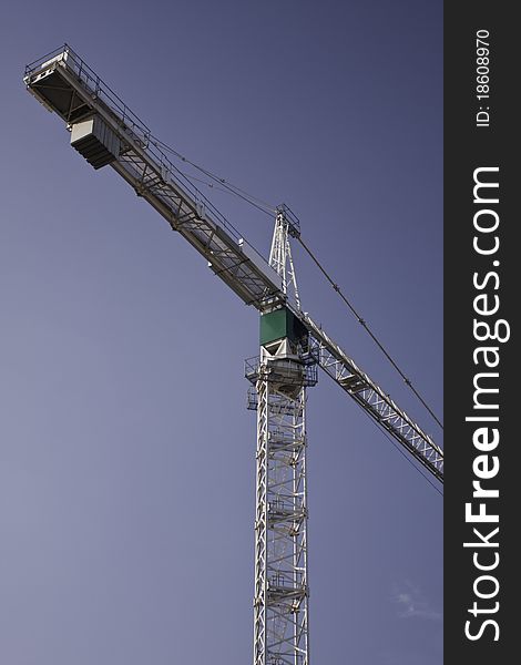 The crane on construction with blue sky. The crane on construction with blue sky