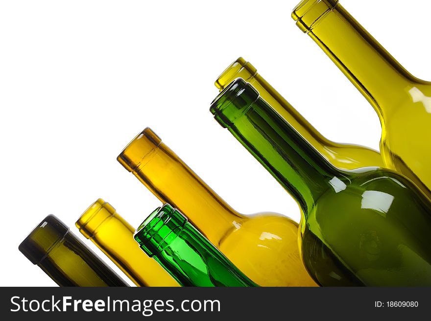 Many empty green wine bottles isolated on white background