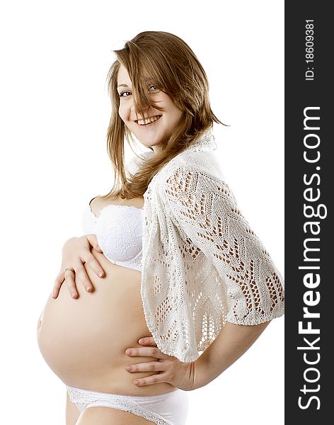 Pretty happy pregnant woman in a white blouse