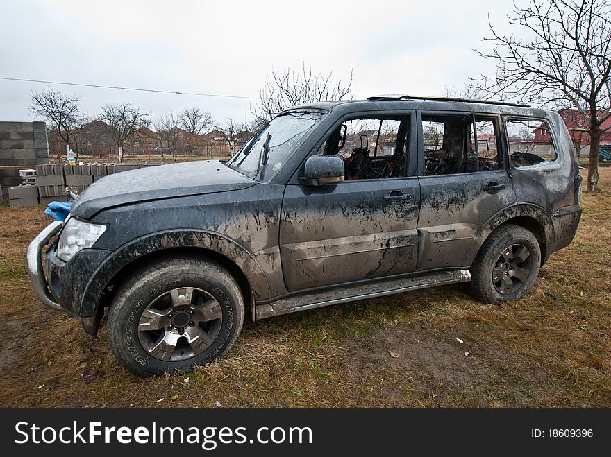 Burned car and left in a field