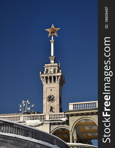 Northern passenger river port of moscow, russia. stalin period architecture. soviet five star symbol with sickle and hammer on telescopic extendable mast