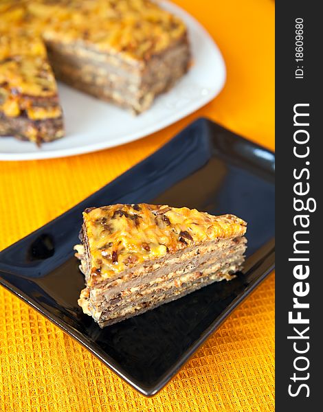 Close-up portion of liver cake with fried carrot and onion