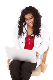 Woman Doctor Looking At Laptop Stock Photo Woman Doctor Looking At Laptop Stock Photo