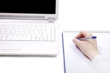 Business Notebook With Laptop And Pen In Hand. Royalty Free Stock Photo
