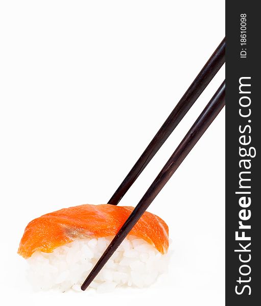 Japanese sushi ready to eat with chopsticks isolated on white