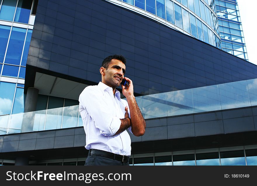 Young and attractive businessman with smile. Young and attractive businessman with smile