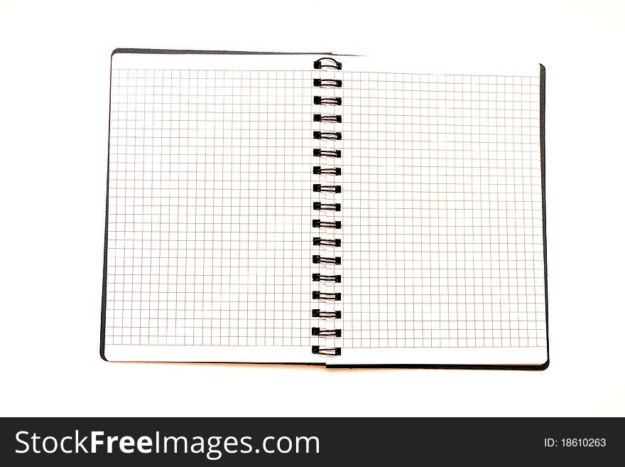 Photo of the uncovered notepad on a white background. Photo of the uncovered notepad on a white background.