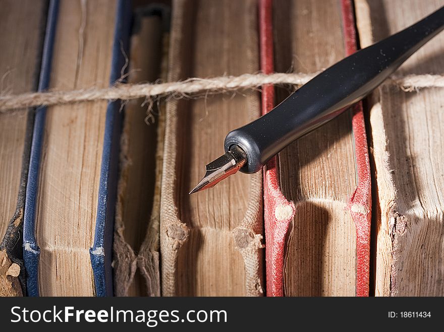 Archival documents in a book-depository are tied up by a cord.