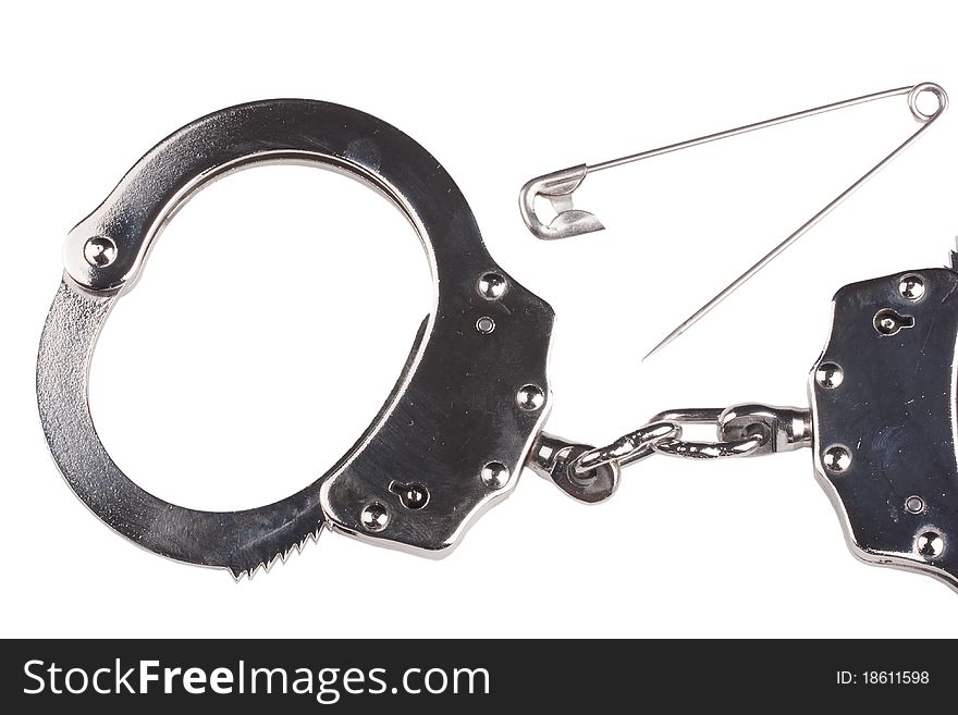 Closed iron handcuffs on a white background.