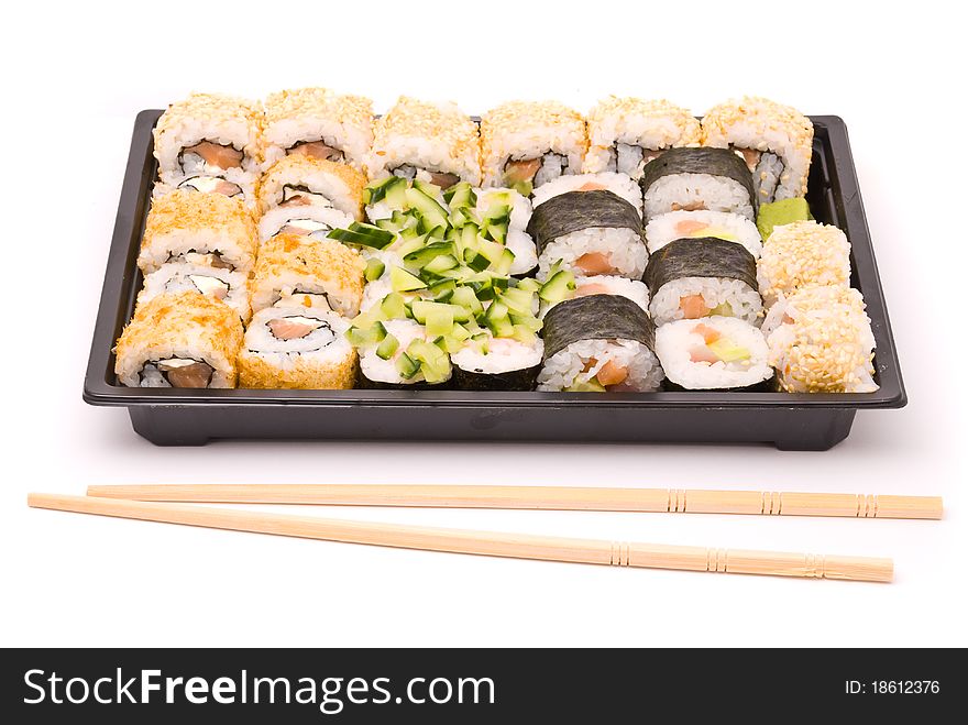 Sushi with chopsticks isolated on a white background