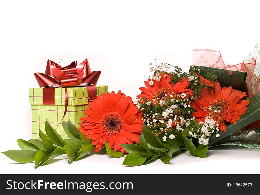 Magnificent bouquet gerbera and present box on a white