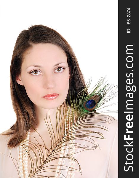 Portrait of a young woman with a peacock feather. Isolated on white