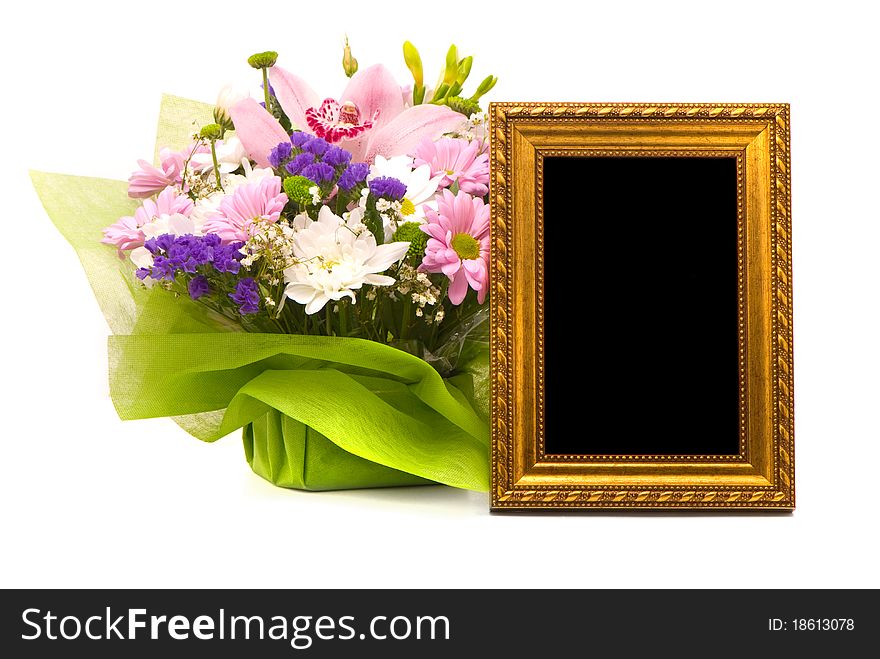 Beautiful bouquet and golden frame on a white