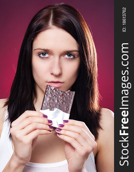 Portrait of young woman with chocolate