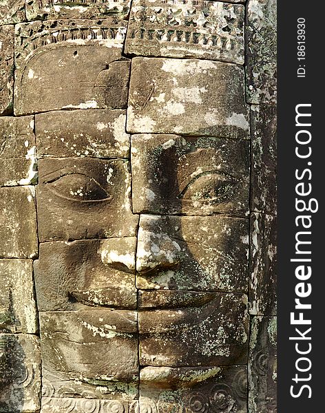 Stone head on towers of Bayon temple in Angkor Thom, Cambodia