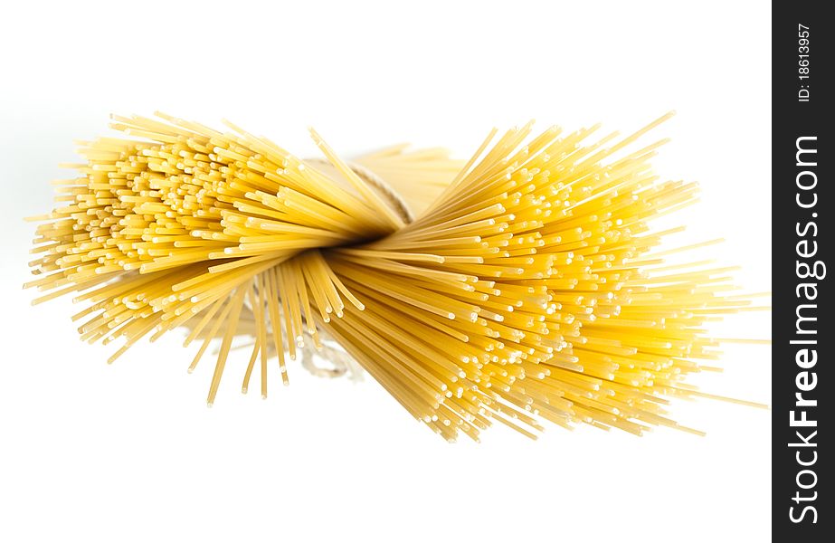 Spaghetti, standing against a white background