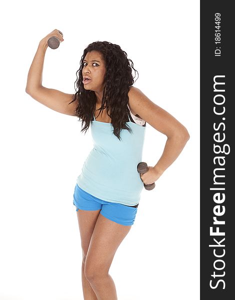 An African American woman is holding a set of weights. An African American woman is holding a set of weights.