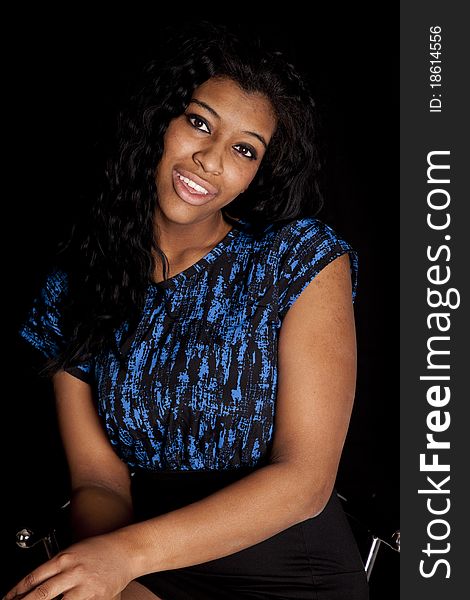 An African American woman is posing for a portrait. An African American woman is posing for a portrait.