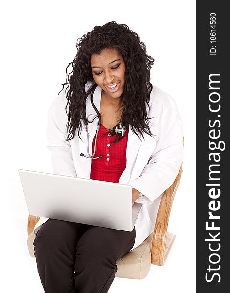 Woman Doctor Looking At Laptop