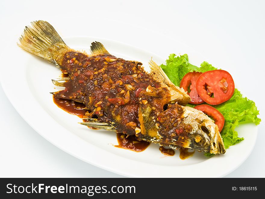 Fried snapper with chili sauce on the plate