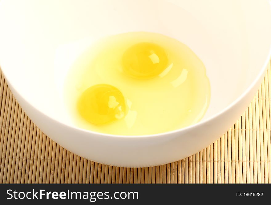 Ingredients for breakfast: eggs in a white bowl