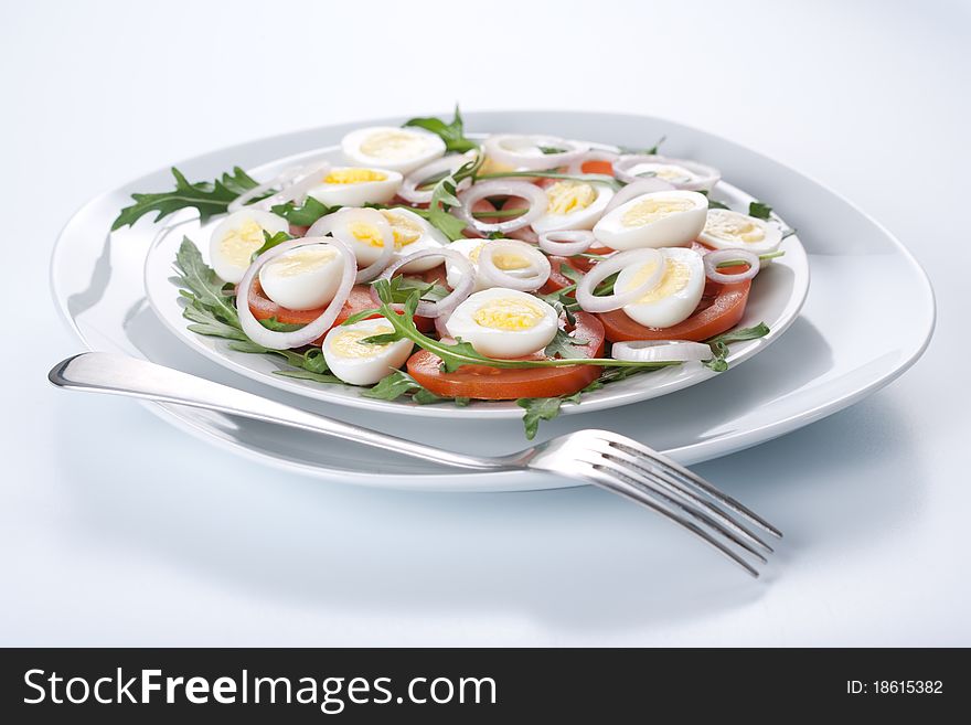 Healthy salad with tomatoes, onions, eggs and rucola. Healthy salad with tomatoes, onions, eggs and rucola
