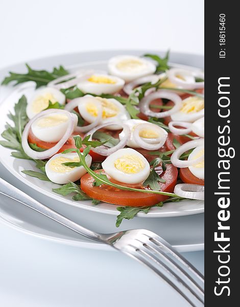 Healthy salad with tomatoes, onions, eggs and rucola. Healthy salad with tomatoes, onions, eggs and rucola