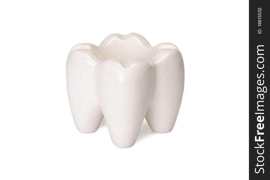 The ashtray in the form of a tooth is isolated on a white background