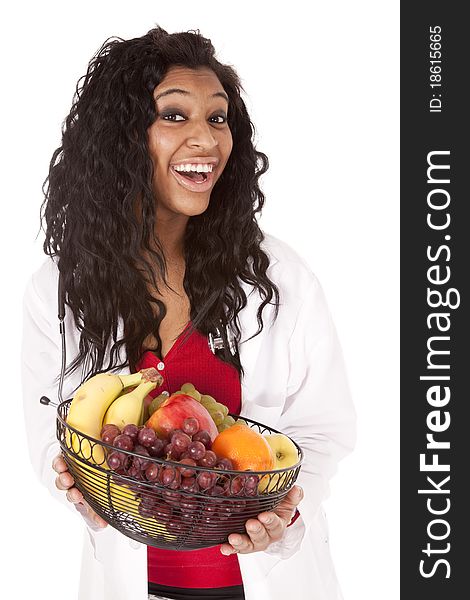 A woman with a stethoscope is holding a fruit basket. A woman with a stethoscope is holding a fruit basket.